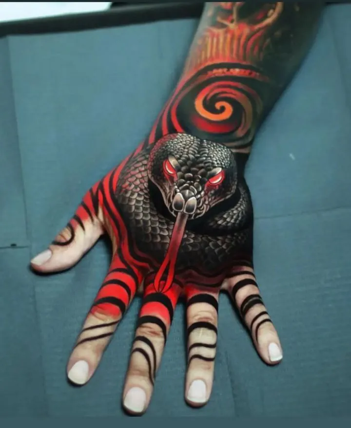 тату питон значение на руке у мужчин